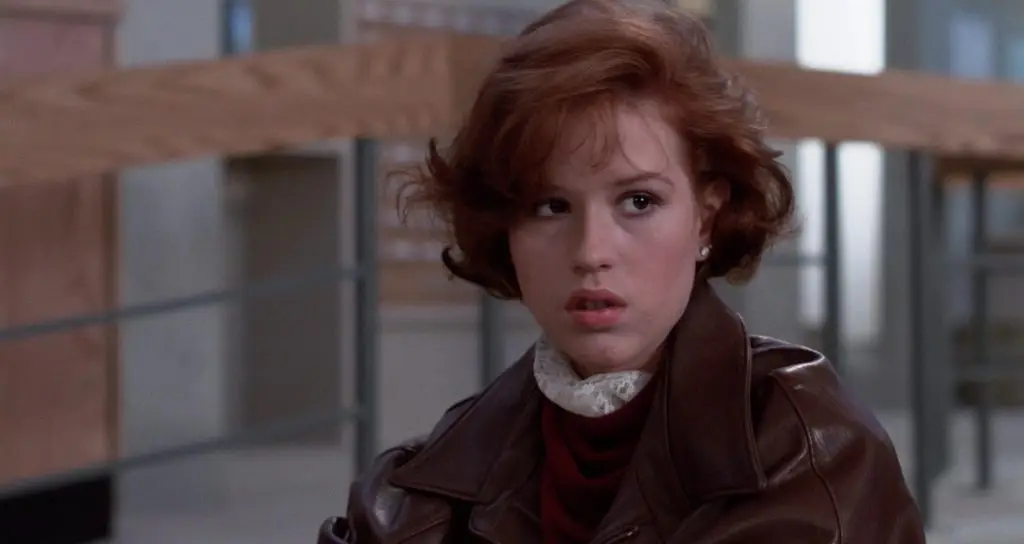 Molly Ringwald in the Breakfast Club wearing a brown leather jacket