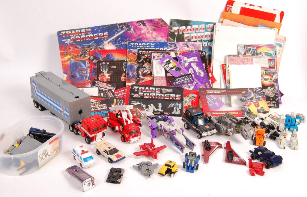 a collection of 80s vintage transformer toys