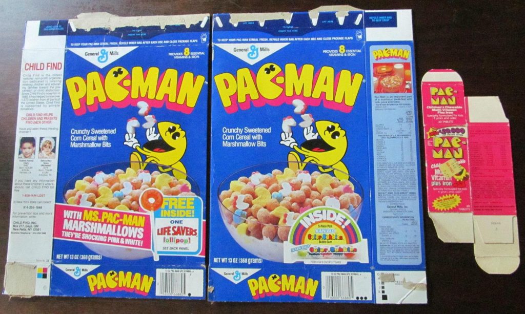Opened boxes of cereal showing the vintage 80s pacman cereal