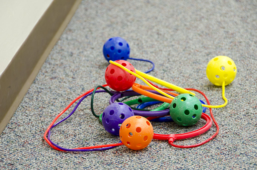 a pile of skip-its 1980s toys in vibrant colors