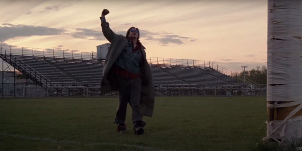 Bender in the football field raising his fist in the breakfast club