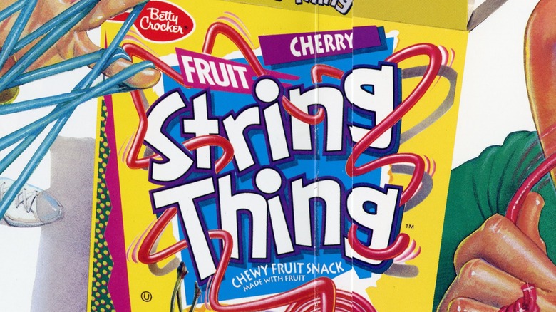 Close-up of vibrant peelable string thing fruit snack strip from the 80s 